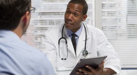 male doctor talking to a man