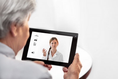 patient doing video call to her doctor